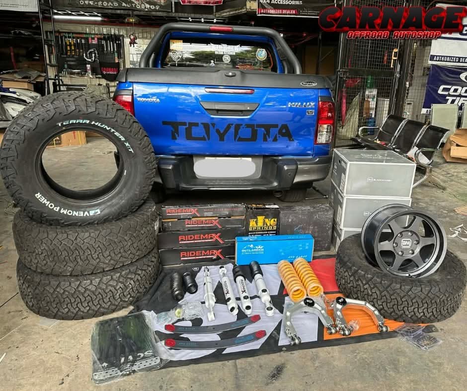 Toyota Hilux build kit — Venom Power tires, Ridemax suspension, BlackRhino mags